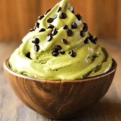 - 3 ripe bananas, peeled, frozen, and sliced - 1 cup coconut milk (or any plant-based milk of your choice) - 1 tablespoon high-quality matcha powder - 1 teaspoon pure peppermint extract - 1/4 cup dark chocolate chips (dairy-free if preferred) - 1 tablespoon maple syrup (optional, for added sweetness) - A pinch of fine sea salt To make Matcha Mint Chocolate Chip Nice Cream, you need simple and fresh ingredients. Start with ripe bananas. They should be sweet and soft. Frozen bananas create a creamy base. Next, you need coconut milk for richness. You can use any plant-based milk if you prefer. Matcha powder gives this nice cream its green color and earthy flavor. Choose a high-quality matcha for the best taste. The peppermint extract adds a fresh kick. It makes the nice cream taste cool and refreshing. Dark chocolate chips add a delightful crunch. Use dairy-free chips if you want a vegan treat. Maple syrup is optional but adds sweetness. Adjust it to your taste. Finally, a pinch of sea salt enhances all the flavors. Gather these ingredients, and you’re ready to create this delicious treat! - Step 1: Prepare Frozen Bananas Start with ripe bananas. Peel and slice them. Freeze the slices for at least 2 hours. This makes your nice cream creamy and cold. - Step 2: Combine Ingredients in Blender Take your frozen banana slices and put them in a high-speed blender. Add 1 cup of coconut milk, 1 tablespoon of matcha powder, and 1 teaspoon of peppermint extract. If you like it sweeter, add 1 tablespoon of maple syrup. Don’t forget a pinch of sea salt! - Step 3: Blend for Smooth Consistency Blend on high until you get a smooth and creamy texture. Stop to scrape the sides if needed. This helps everything mix well. You want it to be like soft serve ice cream. - Step 4: Fold in Chocolate Chips Once blended, carefully fold in 1/4 cup of dark chocolate chips. Use a spatula to mix gently. This keeps the chips whole and adds nice bites of chocolate. - Step 5: Transfer to Freezer Container Pour your nice cream into a freezer-safe container. Smooth the top with your spatula. This helps it freeze evenly. - Step 6: Freezing Time and Serving Tips Freeze for about 2 to 3 hours. If you want it softer, you can enjoy it right away! When serving, scoop into bowls or cones. Enjoy your tasty treat! - Importance of Frozen Bananas: Frozen bananas are the key to creamy nice cream. They add a natural sweetness and a smooth texture. Make sure your bananas are ripe before freezing. Ripe bananas have more flavor and sweetness. Slice them into pieces before freezing for easy blending. - Blending Techniques for Creaminess: Use a high-speed blender or food processor. Start blending on low speed, then increase to high. Stop occasionally to scrape down the sides. This ensures all ingredients mix well. Blend until the mixture looks like soft serve ice cream. - Using Maple Syrup: Maple syrup adds a rich sweetness. It pairs well with matcha and mint flavors. You can add it to taste, but start with one tablespoon. This will help balance the flavors without overpowering them. - Alternatives to Sweeten Nice Cream: If you want other options, consider agave syrup or honey. Both can work great. You can also skip sweeteners for a less sweet nice cream. The frozen bananas will still add some natural sweetness. - Presentation Ideas: For a fun look, scoop the nice cream into colorful bowls or cones. You can top it with extra dark chocolate chips or fresh mint leaves. This makes the dish more inviting and delightful. - Pairing with Other Desserts: Nice cream goes well with brownies or cookies. You can also serve it on top of a warm dessert. The contrast of hot and cold makes each bite exciting. Enjoy your nice cream in many creative ways! {{image_4}} You can make this nice cream even more fun. Try adding other extracts for new tastes. A splash of vanilla extract can add warmth. Almond extract gives a nutty kick. You can mix and match these flavors to find your favorite. Switching up the plant-based milk is another easy way to change things. Coconut milk gives a creamy base. Almond milk is lighter and adds a hint of nuttiness. Oat milk is also a great option, bringing a slight sweetness. Mix-ins can take your nice cream to the next level. Chopped nuts or seeds add a crunchy texture. Try walnuts or sunflower seeds for a tasty twist. You can also add fresh fruits or berries. Sliced strawberries or blueberries bring in bright flavors and colors. If you want a lighter treat, you can reduce the sweeteners. The bananas already add natural sweetness. You might skip the maple syrup altogether or use less. Consider using substitute ingredients, too. Instead of chocolate chips, try cacao nibs for a less sweet option. You can use stevia or monk fruit for a sugar-free alternative. These swaps keep the nice cream delicious while making it healthier. To keep your Matcha Mint Chocolate Chip Nice Cream fresh, choose the right container. A freezer-safe container with a tight lid works best. Glass or BPA-free plastic containers are great options. Make sure the container is not too big; this helps minimize air exposure. To prevent ice crystals, press a piece of parchment paper against the nice cream before sealing the container. This step blocks air and moisture. Also, try to keep the nice cream in the coldest part of your freezer. For the best taste, enjoy your nice cream within one week. After this time, it may lose its creamy texture. Signs of spoilage include a grainy texture or off smell. If you notice any changes, it’s best to discard it. Nice cream is a healthy, dairy-free ice cream made from frozen bananas. It has a creamy texture and is a great way to enjoy dessert without guilt. The benefits include: - Natural sweetness: Bananas provide sweetness without added sugar. - Vegan-friendly: It's entirely plant-based, perfect for vegans. - Nutritious: Packed with vitamins and minerals, nice cream is a nourishing treat. Yes, you can use other fruits in your nice cream! Here are some great options: - Berries: Strawberries, blueberries, or raspberries add a burst of flavor. - Mango: This tropical fruit brings a sweet, tangy taste. - Peaches: Fresh or frozen peaches give a nice, summery feel. Feel free to mix and match your favorites! Yes, this recipe is vegan! All the ingredients are plant-based. Here’s what you’ll find: - Bananas: A vegan staple. - Coconut milk: A creamy, dairy-free alternative. - Dark chocolate chips: Choose dairy-free chips for a vegan option. You can enjoy this nice cream without worry. To make this recipe nut-free, simply use coconut milk as your base. Here are some tips: - Substitute plant-based milk: You can use oat milk or rice milk. - Avoid chocolate with nuts: Choose chocolate chips that are nut-free. This ensures everyone can enjoy this tasty treat! In summary, we explored how to make delicious nice cream using simple, fresh ingredients like ripe bananas and coconut milk. You learned about the steps to prepare it smoothly and the importance of ice crystals. We also covered tips for flavor variations and storage. Nice cream is a fun, healthy treat you can customize. Enjoy making it your own!
