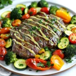 For this dish, you need simple yet high-quality ingredients. Here’s what you will gather: - 1.5 pounds flank steak, well-trimmed - 2 tablespoons unsalted butter, melted - 4 cloves garlic, finely minced - 1 teaspoon smoked paprika - 1 teaspoon garlic powder - 1 teaspoon onion powder - Salt and freshly ground black pepper to taste The right veggies make this meal pop! Choose these colorful vegetables: - 1 bell pepper (red or yellow), sliced into strips - 1 medium zucchini, sliced into half-moons - 1 cup cherry tomatoes, halved - 1 cup fresh broccoli florets - 2 tablespoons extra virgin olive oil Flavor is key to this dish. You’ll use: - Fresh parsley, finely chopped, for garnish - A generous pinch of salt and freshly ground black pepper These ingredients come together to create a rich, savory flavor. The garlic butter sauce enhances the steak, while the veggies add brightness and texture. This mix ensures every bite is full of taste and color. Don't forget to drizzle any leftover garlic butter over your plate for that extra kick! First, set your oven to 425°F (220°C). This high heat helps the steak and veggies cook fast. Next, line a large baking sheet with parchment paper. This makes cleaning up easy after cooking. In a small bowl, melt 2 tablespoons of unsalted butter. Add 4 finely minced garlic cloves. Then mix in 1 teaspoon of smoked paprika, 1 teaspoon of garlic powder, and 1 teaspoon of onion powder. Season this with salt and black pepper. Whisk it all together until it’s well-blended. This mixture adds rich flavor to the steak. Place your 1.5 pounds of flank steak in the center of the baking sheet. Use a brush or spoon to coat both sides with the garlic butter mixture. Make sure the steak is evenly covered. This step ensures the meat stays juicy and tasty. In another bowl, combine your sliced bell pepper, zucchini half-moons, cherry tomatoes, and broccoli florets. Drizzle 2 tablespoons of extra virgin olive oil over them. Season with salt and pepper. Toss everything well until all the veggies are coated. Arrange the vegetables around the steak on the baking sheet. Keep them in a single layer for even cooking. Place the baking sheet in your preheated oven. Roast for 15 to 20 minutes. Use a meat thermometer to check the steak. For medium-rare, it should read 135°F. This ensures a perfect doneness. When the steak is done, carefully take the baking sheet out of the oven. Let the steak rest for about 5 minutes. This step helps the juices stay inside. After resting, slice the steak against the grain into thin strips. Serve the steak with the colorful roasted vegetables. Drizzle any leftover garlic butter from the pan over the dish. Lastly, sprinkle fresh chopped parsley on top to add color and freshness. Enjoy your delicious meal! To cook steak just right, use a meat thermometer. For medium-rare, aim for 135°F. Insert the thermometer into the thickest part of the steak. This helps avoid guesswork. Remember, the steak will continue to cook slightly after you take it out. Let it rest for about five minutes. This keeps the juices inside and makes it juicy and flavorful. Prep your veggies ahead of time. Chop your bell pepper, zucchini, and broccoli a day before. Store them in the fridge in an airtight container. This cuts down on cooking time. You can also make the garlic butter mix in advance. Just whisk the butter and spices together and store it in the fridge. When you’re ready to cook, you can quickly coat the steak. For a stunning look, serve on a rustic wooden board. Place the steak in the center, surrounded by colorful veggies. Drizzle any leftover garlic butter on top for shine. Sprinkle fresh parsley over the dish for a pop of color. This not only makes it look good but also adds a fresh taste. A beautiful presentation makes your meal feel special. {{image_4}} You can use many cuts for this dish. Flank steak is great, but try sirloin or ribeye. These cuts are tender and flavorful. If you want something leaner, go for tenderloin. Each cut has its unique taste and texture. Adjust cooking times based on thickness. Thicker cuts need more time, while thinner cuts cook fast. Feel free to swap out the veggies. Asparagus, green beans, or carrots work well. You can also use mushrooms for an earthy flavor. If you want a sweeter touch, add sweet potatoes. Just keep in mind the cooking time for each vegetable. Some may need a bit longer to roast. You can change the flavor in many ways. Add fresh herbs like rosemary or thyme for depth. Experiment with spices like cumin or chili powder for a kick. If you like heat, try adding red pepper flakes. You can also mix in a splash of soy sauce for an umami boost. The options are endless, so have fun with it! To store your leftovers, let the food cool first. Then, place the steak and veggies in an airtight container. You can keep them in the fridge for up to three days. Make sure to keep the steak and veggies separate to keep them fresh. To reheat, preheat your oven to 350°F (175°C). Place the steak and veggies on a baking sheet. Heat for about 10-15 minutes or until warmed through. You can also use a microwave if you are in a hurry. Just be careful not to overheat, as this can dry out the steak. You can freeze this dish if you want to save some for later. Wrap the cooled steak tightly in plastic wrap, then place it in a freezer bag. Freeze the veggies in a separate bag. You can freeze both for up to three months. When ready to eat, thaw them in the fridge overnight before reheating. Cooking steak in the oven takes about 15 to 20 minutes. The exact time depends on your steak's thickness and your desired doneness. For medium-rare, check for an internal temperature of 135°F. Always use a meat thermometer to ensure accuracy. Yes, you can use frozen vegetables! They are convenient and save time. Just make sure to thaw them first. Pat them dry to avoid excess moisture. This way, your veggies will roast nicely and stay crisp. Many seasonings work well with garlic butter steak. Here are some favorites: - Rosemary - Thyme - Black pepper - Chili flakes These flavors add depth and enhance the steak's taste. Flank steak is a great choice, but it's not the only option. It is tender and full of flavor. Other cuts like sirloin or ribeye work well, too. Choose a cut that fits your taste and budget. Yes, grilling is a fantastic option! Preheat your grill to medium-high heat. Cook the steak for about 5 to 7 minutes per side. Grill the veggies in a grill basket for a smoky flavor. Enjoy the outdoor cooking experience! This post covered how to make a tasty sheet-pan garlic butter steak dish. We discussed key ingredients, simple steps, and helpful tips for perfect steak. You can use different cuts of steak and swap vegetables for variety. Save time with meal prep ideas and presentation tips. Remember to follow storage guidelines for leftovers. Enjoy making this easy, delicious meal that fits into your busy life. With these steps, you can create a dish that impresses and satisfies. Your kitchen adventures will be fun and rewarding!