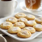 To make these chai spiced sugar cookies, you will need: - 2 ¾ cups all-purpose flour - 1 teaspoon baking powder - ½ teaspoon baking soda - ½ teaspoon salt - 2 teaspoons ground cinnamon - 1 teaspoon ground ginger - ½ teaspoon ground cardamom - ½ teaspoon ground cloves - 1 cup unsalted butter, softened to room temperature - 1 cup granulated sugar, plus extra for rolling - ½ cup powdered sugar - 1 large egg - 1 teaspoon vanilla extract You can add a few fun twists to your cookies. Consider: - ½ cup chopped nuts for crunch - ½ cup chocolate chips for a sweet surprise - A pinch of nutmeg for extra warmth Having the right tools makes baking easier. You will need: - Mixing bowls: one large and one medium - Electric mixer for creaming ingredients - Measuring cups and spoons for accuracy - Baking sheets lined with parchment paper - A wire rack for cooling the cookies - Cookie scoop for even portions Start by preheating your oven to 350°F (175°C). Line two baking sheets with parchment paper. This helps the cookies not to stick. In a medium bowl, whisk together these dry ingredients: - 2 ¾ cups all-purpose flour - 1 teaspoon baking powder - ½ teaspoon baking soda - ½ teaspoon salt - 2 teaspoons ground cinnamon - 1 teaspoon ground ginger - ½ teaspoon ground cardamom - ½ teaspoon ground cloves Set this mix aside. It adds great flavor to your cookies. In a large bowl, cream together: - 1 cup unsalted butter, softened - 1 cup granulated sugar - ½ cup powdered sugar Use an electric mixer. Beat until the mix is light and fluffy. This should take about 3-4 minutes. Add in one large egg and 1 teaspoon of vanilla extract into the creamed mixture. Mix well until everything is combined. This adds richness to your cookies. Gradually add the dry ingredient mix to the wet mixture. Use low speed on your mixer. Mix until just combined. Be careful not to overmix, as it can change the cookie texture. Transfer the dough to the fridge. Chill for about 30 minutes. This step is key for making the dough easier to handle later. Once chilled, scoop tablespoon-sized portions of dough. Roll them into balls with your hands. Roll each ball in granulated sugar until fully coated. Place them on the baking sheets, leaving about 2 inches between each cookie. This space allows them to spread. Flatten each cookie slightly using a fork or the bottom of a glass. Put the cookie sheets in the oven and bake for 10-12 minutes. Look for lightly golden edges to know they are done. After baking, take the sheets out of the oven. Let the cookies cool on the sheets for 5 minutes. Then, move them to a wire rack to cool completely. This helps them stay soft and delicious. To get that soft and chewy texture, chill the dough. Chilling helps the butter firm up. This step prevents the cookies from spreading too much during baking. Aim for a smooth dough that's not too sticky. You want it to hold its shape but still be soft. Accurate measuring is key to great cookies. Use a kitchen scale for flour if you have one. If not, spoon flour into a measuring cup and level it off with a knife. Avoid packing the flour down, as this can lead to dry cookies. Measure your sugar with the same care for best results. Mix just until the ingredients combine. Overmixing can make cookies tough. When you add the dry ingredients, use low speed. Stir gently to keep the dough light. This keeps your cookies soft and tender. For a lovely display, place your cookies on a festive plate. Dust them with powdered sugar for a touch of elegance. Pair these cookies with a warm cup of chai. This enhances the spice and creates a cozy experience. Enjoy sharing them with family and friends! {{image_4}} You can make your chai spiced sugar cookies even better by adding nuts or chocolate chips. Try chopped walnuts or pecans for a crunchy texture. If you love chocolate, mix in some semi-sweet chocolate chips. Just fold them in gently after you combine the wet and dry mixtures. This will give each bite a delightful surprise. If you need a gluten-free option, use a gluten-free flour blend. These blends often work well in cookie recipes. You can also try almond flour for a nutty flavor. Just keep in mind that gluten-free flours can change the cookie's texture. You might want to add a bit of xanthan gum to help with binding. To change the flavor of your cookies, experiment with seasonal spices. In fall, add nutmeg or allspice for warmth. In winter, try a hint of star anise for a unique twist. Just a little extra spice can make your cookies taste festive and cozy. Adjust the amounts to suit your taste. Store your baked chai spiced sugar cookies in an airtight container. This keeps them soft and fresh. Layer parchment paper between cookies to avoid sticking. Place the container in a cool, dry area. Avoid direct sunlight as it can dry them out. You can freeze the cookie dough for later use. First, scoop the dough into balls and roll them. Next, place them on a baking sheet and freeze until firm. After that, transfer the balls into a freezer bag. Keep them in the freezer for up to three months. When ready to bake, just add a few extra minutes to the baking time. Baked cookies last about one week at room temperature. For longer freshness, store them in the fridge for two weeks. Make sure to check for any signs of spoilage before eating. Enjoy these soft cookies with a warm drink. Their spice flavor pairs well with tea or coffee. Chai spices are a blend of warm flavors. They often include cinnamon, ginger, cardamom, and cloves. These spices create a cozy, comforting taste. In my chai spiced sugar cookies, I use: - 2 teaspoons ground cinnamon - 1 teaspoon ground ginger - ½ teaspoon ground cardamom - ½ teaspoon ground cloves These spices make the cookies rich and aromatic. They add a unique twist to classic sugar cookies. Yes, you can substitute some ingredients if needed. If you don’t have all-purpose flour, try a gluten-free blend. For butter, use coconut oil or a vegan butter. You can swap granulated sugar with coconut sugar for a different flavor. Just remember that texture may change a bit. To make vegan chai spiced sugar cookies, you need to replace the egg. Use a flax egg instead. Mix 1 tablespoon of flaxseed meal with 2.5 tablespoons of water. Let it sit for 5 minutes. This helps bind the cookies. Also, use vegan butter in place of regular butter. Follow the same steps in the recipe. Store your cookies in an airtight container. This keeps them soft and fresh. Layer parchment paper between the cookies to prevent sticking. For longer storage, keep them in the fridge. They will last longer that way. Chai spiced sugar cookies can last about a week. When stored properly, they remain soft and delicious. If you freeze them, they can last for up to three months. Just thaw them in the fridge before enjoying. Yes, you can use brown sugar instead of granulated sugar. Brown sugar adds moisture and a richer flavor. The cookies may be a bit chewier. Just keep the same amount, one cup, for best results. Baking cookies can be fun and easy with the right steps. We covered key ingredients, tools, and methods to make perfect cookies. I shared tips for texture, measuring, and presentation. You learned about tasty variations and proper storage. Now, it’s your turn to bake. Enjoy the process and share your creations!