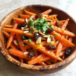 - 4 large carrots, peeled and coarsely grated - 1/2 cup raisins or currants - 1/4 cup sliced almonds or walnuts - 1/4 cup fresh cilantro, finely chopped - 1 tablespoon ground cumin - 1 teaspoon ground cinnamon - 1 teaspoon ground coriander - 1/2 teaspoon cayenne pepper - 3 tablespoons extra virgin olive oil - 2 tablespoons freshly squeezed lemon juice - Salt and freshly ground black pepper to taste You can switch out the carrots for parsnips if you want a unique twist. Instead of raisins, try dried cranberries for a tart flavor. If you prefer different nuts, sunflower seeds or pumpkin seeds work well too. You can skip the cilantro and try parsley for a milder taste. If you want more heat, add more cayenne pepper. For a sweeter touch, drizzle in a bit of honey or maple syrup. Carrots are high in beta-carotene, which helps your eyes and skin. They also provide fiber, aiding digestion. Raisins or currants add natural sweetness and iron, which is good for blood health. Nuts like almonds or walnuts give healthy fats, supporting heart health. Olive oil is rich in antioxidants and can lower bad cholesterol. Lemon juice boosts vitamin C, enhancing your immune system. Spices like cumin and coriander can improve digestion and add anti-inflammatory benefits. {{ingredient_image_2}} Start by peeling and grating the carrots. You want them coarsely grated for the best texture. Next, measure out your raisins or currants. Both add a nice sweetness. If you prefer nuts, slice your almonds or walnuts. These will give your salad a good crunch. Finally, chop your fresh cilantro to add a burst of flavor. In a large mixing bowl, combine the grated carrots and your choice of raisins or currants. Mix them well to ensure they are evenly distributed. This step is key for the sweetness to shine through. Once mixed, set the bowl aside as you prepare the dressing. Grab a smaller bowl and whisk together the spices. Add the ground cumin, cinnamon, coriander, and cayenne pepper. Next, pour in the olive oil and lemon juice. Add a pinch of salt and pepper to enhance the flavors. Whisk until everything blends nicely. This dressing is the heart of your salad. After mixing the dressing, drizzle it over the carrot mixture. Use two forks or your hands to toss everything gently. Make sure each carrot strand gets coated in that delicious dressing. Finally, fold in the chopped cilantro and nuts. This adds layers of flavor and texture. Let the salad rest for about 10-15 minutes. This helps the flavors come together. Before serving, taste the salad and adjust the seasoning if needed. Enjoy your fresh and vibrant Moroccan spiced carrot salad! To make the best Moroccan spiced carrot salad, use fresh carrots. Grate them just before mixing. This keeps them crunchy and sweet. Balance the flavors well. Add enough lemon juice for zing and adjust the cayenne for heat. If you want a sweeter salad, add more raisins or currants. Toss gently but thoroughly. This helps coat every carrot piece in dressing. Presentation matters! Serve the salad in a rustic wooden bowl to keep it warm. Top it with extra chopped cilantro and whole nuts. This adds color and texture. If you have space, sprinkle some edible flowers on top. They add a nice touch and make the dish pop. Remember, we eat with our eyes first! One mistake is not letting the salad rest. Allowing it to sit helps flavors blend. Avoid overdoing the spices. Start with less; you can always add more. Also, don&rsquo;t skip the salt. It enhances all the flavors. Lastly, remember to taste before serving. Adjust seasoning as needed. This can make a big difference! Pro Tips Use Fresh Ingredients: Always opt for the freshest carrots and herbs to enhance the flavor and nutritional value of your salad. Adjust the Spices: Feel free to tweak the spices according to your taste. If you prefer a milder flavor, reduce the cayenne pepper. Let it Rest: Allowing the salad to rest for a short while before serving helps the flavors meld together beautifully. Experiment with Nuts: Try different types of nuts or seeds like pistachios or sunflower seeds for a unique twist on texture and flavor. {{image_4}} You can switch up your Moroccan spiced carrot salad with different nuts and dried fruits. Instead of almonds, try walnuts for a richer taste. Pecans add a unique flavor too. For dried fruits, apricots or dates can add a sweet touch. If you want a crunchier salad, add sunflower seeds or pumpkin seeds. These small changes keep the salad fresh and exciting. You can adjust the spice levels to match your taste. If you love heat, add more cayenne pepper. For a milder flavor, reduce the cayenne or leave it out. You can also add a pinch of smoked paprika for a smoky twist. If you prefer a sweeter salad, add more raisins or honey. Each tweak gives you a new flavor experience. For serving, I recommend a rustic wooden bowl to show off the vibrant colors. You can top the salad with extra chopped cilantro and nuts. This adds a nice touch and makes it more inviting. Serve it as a side dish with grilled meats or as a light lunch on its own. Pair it with flatbreads or pita for a complete meal. Enjoy your delightful Moroccan spiced carrot salad! To keep your Moroccan spiced carrot salad fresh, place it in an airtight container. Make sure to seal the container well to prevent air from getting in. You can also cover the bowl tightly with plastic wrap. This helps maintain the salad's flavor and crunch. This salad is best enjoyed cold, so reheating is not needed. If you prefer it warm, you can lightly saut&eacute; it on low heat for a few minutes. However, this may soften the carrots and change the texture. Keep in mind that the flavors may alter slightly if heated. When stored properly, this salad lasts up to three days in the fridge. After that, the carrots may lose their crispness and freshness. Always check for any off smells or changes in color before eating leftovers. If you notice any, it&rsquo;s best to discard the salad for safety. Moroccan Spiced Carrot Salad is a bright and tasty dish. It features grated carrots mixed with raisins or currants. The blend of spices, like cumin and cinnamon, gives it a warm flavor. You also add nuts for crunch and fresh herbs for brightness. This salad is colorful and full of textures, making it a feast for your eyes and taste buds. Yes, you can make this salad ahead of time. Prepare it and let it sit for 10-15 minutes. This resting time allows the flavors to blend well. You can also store it in the fridge for up to three days. Just be sure to give it a good stir before serving. This salad pairs well with many dishes. You can serve it with grilled chicken or fish for protein. It also complements couscous or quinoa nicely. For a vegetarian meal, try it with falafel or roasted vegetables. These combinations create a tasty and balanced meal. Yes, this salad is vegan-friendly. It does not contain any animal products. The ingredients are all plant-based and healthy. Enjoy this salad as part of a vegan meal plan or as a side dish at any gathering. This blog post covers how to make a great Moroccan spiced carrot salad. You learned about key ingredients, easy step-by-step instructions, and helpful tips. We explored variations and how to store it properly. In closing, this salad is not only tasty but also healthy and easy to make. Enjoy experimenting with flavors and sharing it with friends and family. Your fresh take on this dish can make any meal shine.