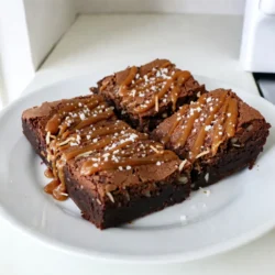 To make Caramel Coconut Brownies, gather the following ingredients: - 1 cup unsweetened cocoa powder - 1 cup all-purpose flour - 1 teaspoon baking powder - &frac12; teaspoon salt - 1 cup granulated sugar - &frac12; cup packed brown sugar - 1 cup unsalted butter, melted - 4 large eggs - 1 teaspoon pure vanilla extract - 1 cup shredded sweetened coconut - 1 cup caramel sauce (can be store-bought or homemade) - Flaky sea salt, for finishing Each ingredient plays a key role in the flavor and texture of the brownies. The cocoa powder gives a rich chocolate taste. The sugars add sweetness and moisture. The eggs help bind everything together, while the coconut adds a chewy texture. The caramel sauce brings a sweet, gooey layer that makes these brownies special. Finally, flaky sea salt enhances the flavors and makes each bite irresistible. Choosing high-quality ingredients makes a big difference in your final dish. {{ingredient_image_2}} 1. First, preheat your oven to 350&deg;F (175&deg;C). This helps your brownies bake evenly. 2. Prepare a 9x13 inch baking pan. You can lightly grease it or use parchment paper. This makes it easy to take the brownies out later. 3. In a medium bowl, mix together the cocoa powder, flour, baking powder, and salt. Whisk until combined. Set this aside for now. 4. In a large bowl, combine the melted butter, granulated sugar, and brown sugar. Mix well until the sugars blend with the butter. 5. Add the eggs to the butter mixture, one at a time. Mix well after each egg. Then, stir in the vanilla extract until it is evenly mixed. 1. Now, slowly fold the dry ingredients into the wet mixture. Use a spatula and combine gently. Be careful not to over-mix; this keeps your brownies soft. 2. Next, gently fold in the shredded coconut. Make sure it spreads evenly throughout the batter. 3. Pour half of the brownie batter into the prepared baking pan. Use a spatula to smooth it out into an even layer. 4. Drizzle half of the caramel sauce on top of this layer. Use a knife or toothpick to swirl the caramel into the batter. 5. Carefully pour the rest of the brownie batter over the first layer. Smooth it out again. Top with the remaining caramel sauce and swirl for a nice design. 1. Bake in your preheated oven for 25-30 minutes. To check if they are done, insert a toothpick into the center. It should come out with a few moist crumbs. 2. After baking, remove the brownies from the oven. Allow them to cool in the pan for at least 15 minutes. This helps set the caramel. 3. For finishing touches, sprinkle flaky sea salt over the top. Cut into squares and serve warm or let them cool completely. Enjoy! To avoid over-mixing the batter, mix gently. Once you add the dry ingredients, stir just until no flour shows. Over-mixing can lead to tough brownies. You want them to be soft and chewy, not dense. When checking for doneness, insert a toothpick into the center. If it comes out with a few moist crumbs, your brownies are ready. If it&rsquo;s wet with batter, bake a few more minutes. Keep an eye on them to avoid overbaking. For extra flavor, add toppings like chopped nuts or chocolate chips. You can also sprinkle some shredded coconut on top before baking. Each bite will have a delightful crunch. Serving these brownies with vanilla ice cream makes them even better. The warm caramel melts into the ice cream, creating a tasty mix. It&rsquo;s a great way to cool down and enjoy a rich dessert. Pro Tips Use Room Temperature Ingredients: Ensure that your eggs and butter are at room temperature before mixing. This helps create a smoother batter and results in a better texture for your brownies. Don&rsquo;t Overmix: When combining the dry ingredients with the wet, mix just until incorporated. Overmixing can lead to dense brownies instead of the desired fudgy texture. Cool Before Cutting: Allow the brownies to cool completely in the pan before cutting them into squares. This helps them set and makes them easier to cut without crumbling. Enhance Your Caramel: If using store-bought caramel, consider warming it slightly before drizzling. This makes it easier to swirl into the brownie batter and enhances the overall flavor. {{image_4}} You can easily adapt this recipe to fit your needs. Here are some ideas: - Vegan options: Replace the eggs with flaxseed meal. Use 1 tablespoon of flaxseed mixed with 3 tablespoons of water for each egg. Swap the unsalted butter for coconut oil or vegan butter. Choose a plant-based caramel sauce to keep it dairy-free. - Gluten-free alternatives: Use a gluten-free all-purpose flour blend instead of regular flour. This change keeps the brownies rich and moist without altering the flavor. Enhance these brownies with fun flavor twists. Here are two easy options: - Including nuts or chocolate chips: Add 1 cup of chopped nuts, like walnuts or pecans, for crunch. You can also mix in 1 cup of semi-sweet or dark chocolate chips for extra chocolaty goodness. - Using flavored caramel or sauces: Try flavored caramel sauces, like sea salt or espresso, to give your brownies a unique twist. You can even swirl in some peanut butter or Nutella for a decadent layer of flavor. You can store your leftover brownies in different ways. If you plan to eat them within a few days, keep them at room temperature. Place the brownies in an airtight container. This keeps them fresh and moist. If you want to store them longer, the fridge works too. Wrap the brownies tightly in plastic wrap. Then place them in an airtight container. This helps them stay good for about a week. Freezing brownies is a great way to enjoy them later. Start by cutting the brownies into squares. Wrap each square in plastic wrap to keep them fresh. Then, place the wrapped brownies in a freezer-safe bag or container. Make sure to label the bag with the date. Brownies can last in the freezer for up to three months. When you want to eat them, let them thaw in the fridge overnight. For a warm treat, you can microwave them for a few seconds after thawing. Enjoy your sweet treat anytime! Can I make these brownies ahead of time? Yes, you can! These brownies keep well for a few days. Bake them, then store in an airtight container. This way, they stay fresh and tasty. You can also freeze them for longer storage. How do I store brownies to keep them fresh? Store your brownies in an airtight container. If they cool completely, they stay moist. You can keep them at room temperature. For longer life, put them in the fridge. Just be sure to let them warm to room temp before serving. What can I substitute if I don't have coconut? If you don't like coconut, try using chopped nuts. Walnuts or pecans work well. You can also use chocolate chips for a different flavor. Adjust the amount based on your taste. How do I know when brownies are done baking? Check at 25 minutes. Insert a toothpick into the center. If it comes out with a few moist crumbs, they are done. The top should look set and slightly shiny. Can I serve these brownies warm? Yes! Warm brownies are delicious. The caramel is gooey, and the flavors mix well. Serve them with a scoop of vanilla ice cream for a special treat. What pairs well with caramel coconut brownies? These brownies pair great with vanilla ice cream or whipped cream. You can also enjoy them with coffee or a glass of milk. They make a perfect dessert for any occasion. This blog post showed you how to make delicious caramel coconut brownies. We covered the key ingredients, preparation steps, and baking techniques. I shared tips for perfecting your brownies and suggested fun variations. Storing and enjoying your brownies was also discussed. With these ideas and your own flair, you&rsquo;ll create tasty treats everyone loves. Happy baking!